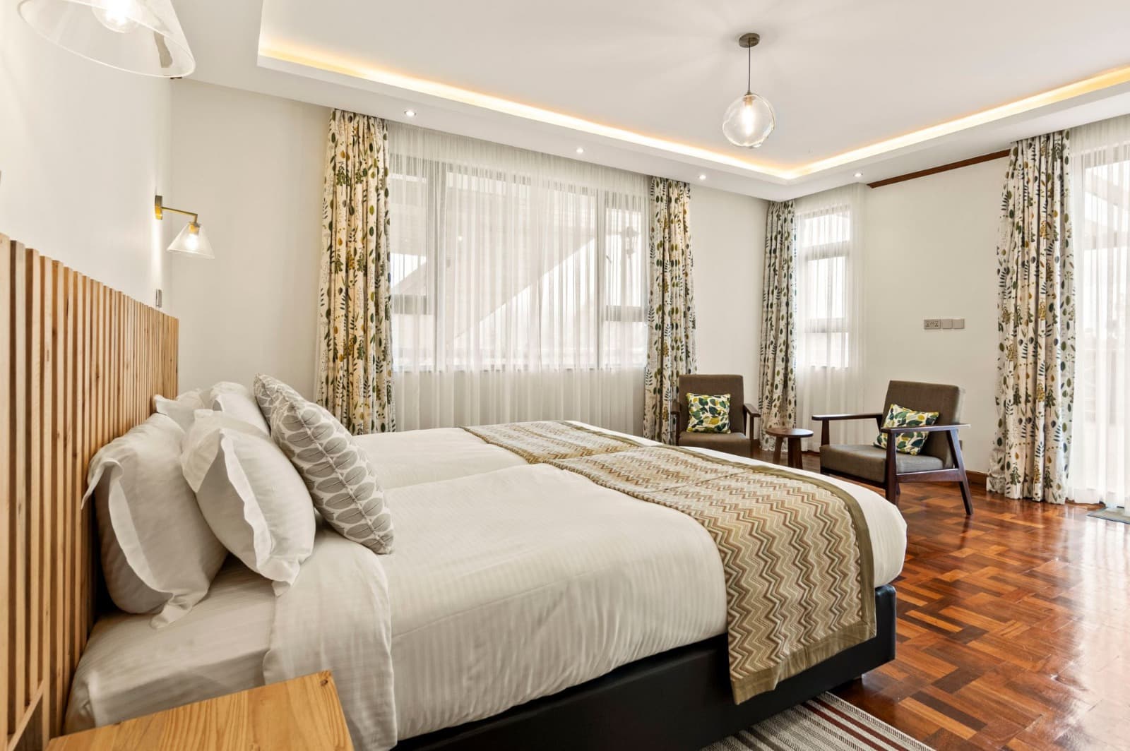 Kirimara Woodlands bright bedroom with large windows